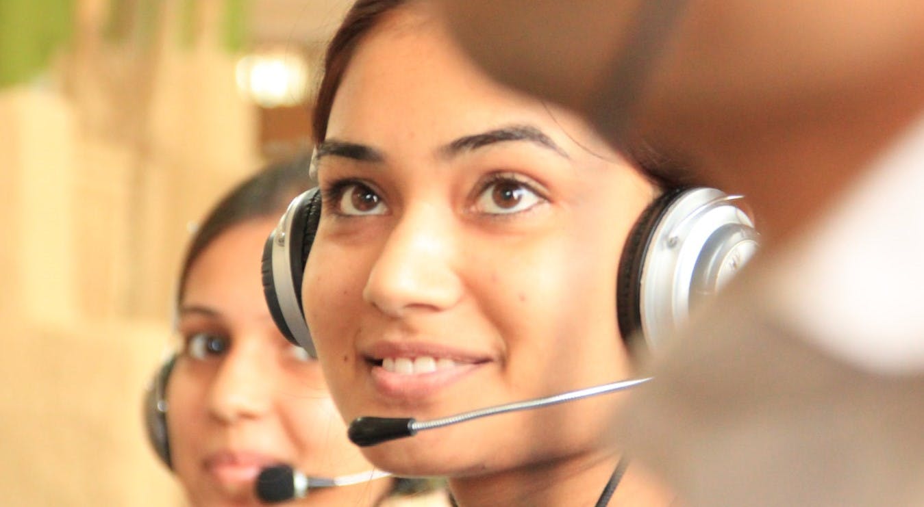 Young woman with a headset smiling