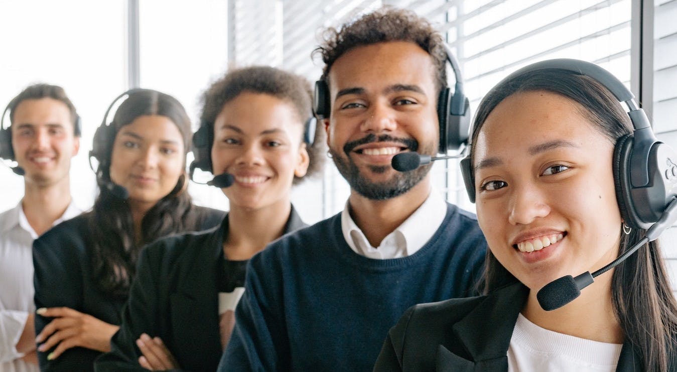 Call center employees smiling 